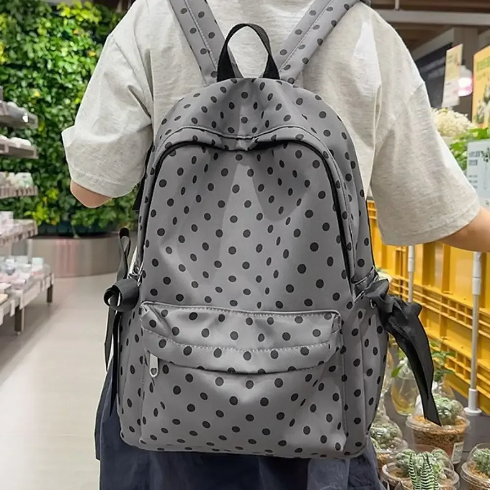 Sac à dos mignon et adorable à pois, minimaliste, avec plusieurs poches et un nœud, léger et durable, idéal pour les étudiants et l'utilisation en extérieur.