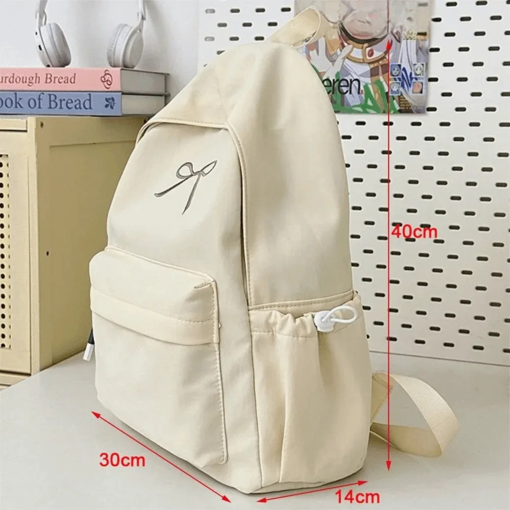 sac à dos pour filles avec nœud brodé, en nylon, grande capacité, léger, couleur unie, pour étudiants, sac d'école, sac de voyage