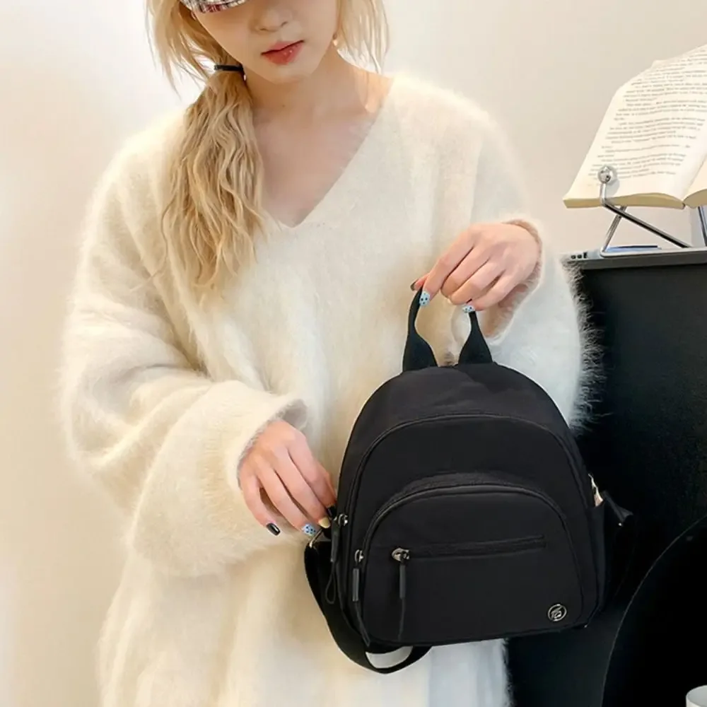 sac à dos portable pour femmes en nylon léger, couleur unie, multi-poches, décontracté et tendance avec poignée