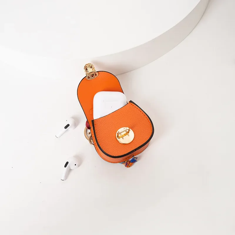 pochette porte-clés multifonctionnelle et portable, tendance et polyvalente, en forme de selle, avec porte-monnaie et étui de rangement pour écouteurs sans fil.