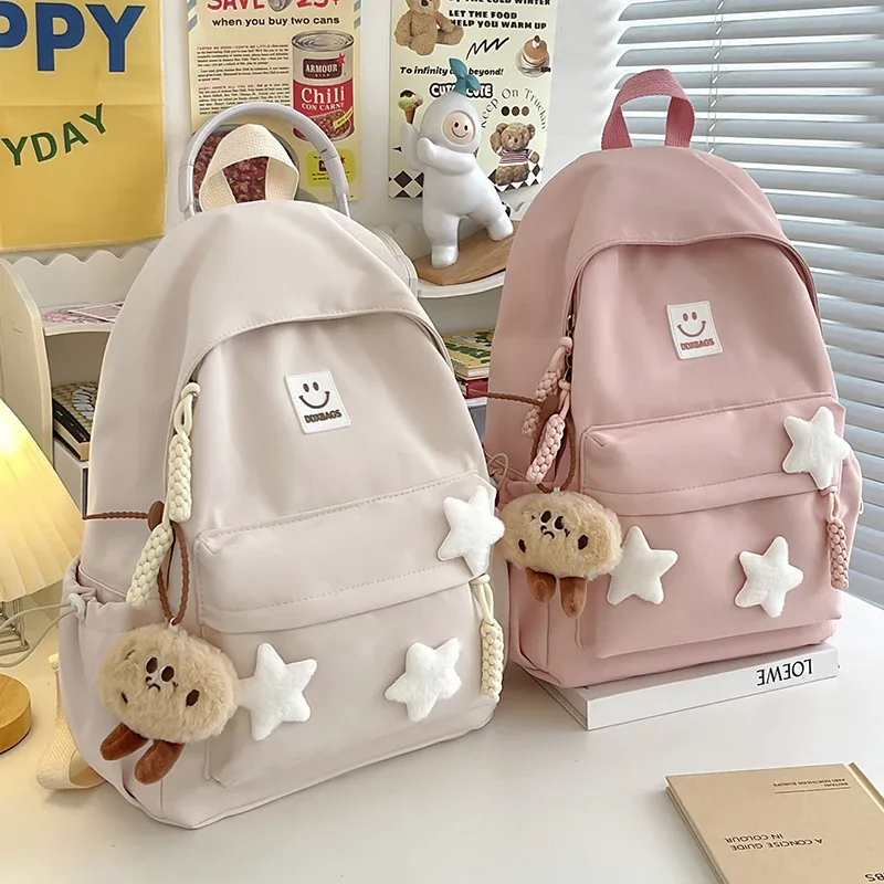 sac à dos rose mignon pour filles cartable à la mode décoré d'étoiles avec porte-clés en peluche parfait pour une utilisation quotidienne et l'école style adorable et tendance idéal pour adolescente