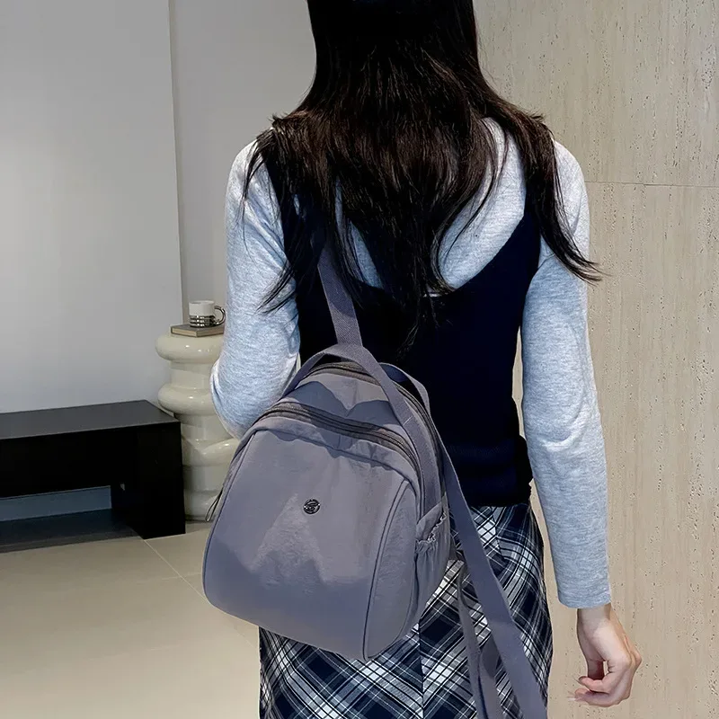 nouveau petit sac à dos de banlieue en plein air voyage décontracté simple sac à main pour femmes grande capacité couleur unie double sacs à bandoulière