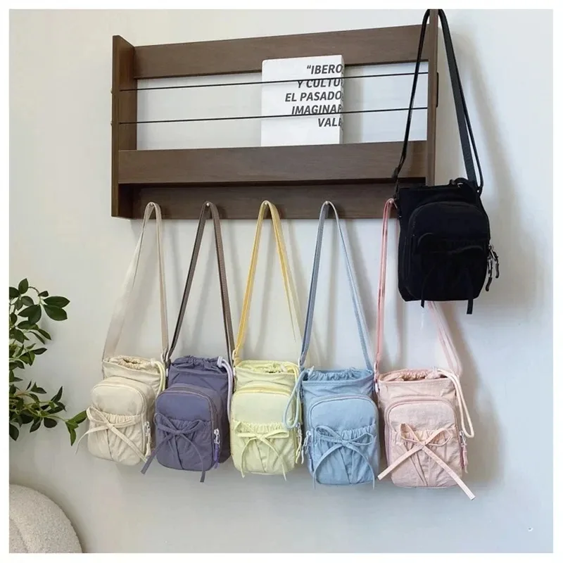 nouveau sac bandoulière léger pour téléphone portable pour femme, sac de sport extérieur, sac de cyclisme, porte-bouteille d'eau, sac de voyage, design à nœuds