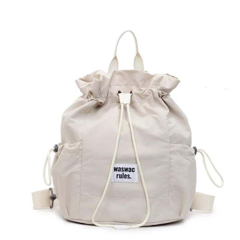 sac en toile polyvalent de grande capacité, décontracté, nouvelle mode d'été 2025, sac à dos à cordon de serrage, concis, couleur unie, sacs d'école légers
